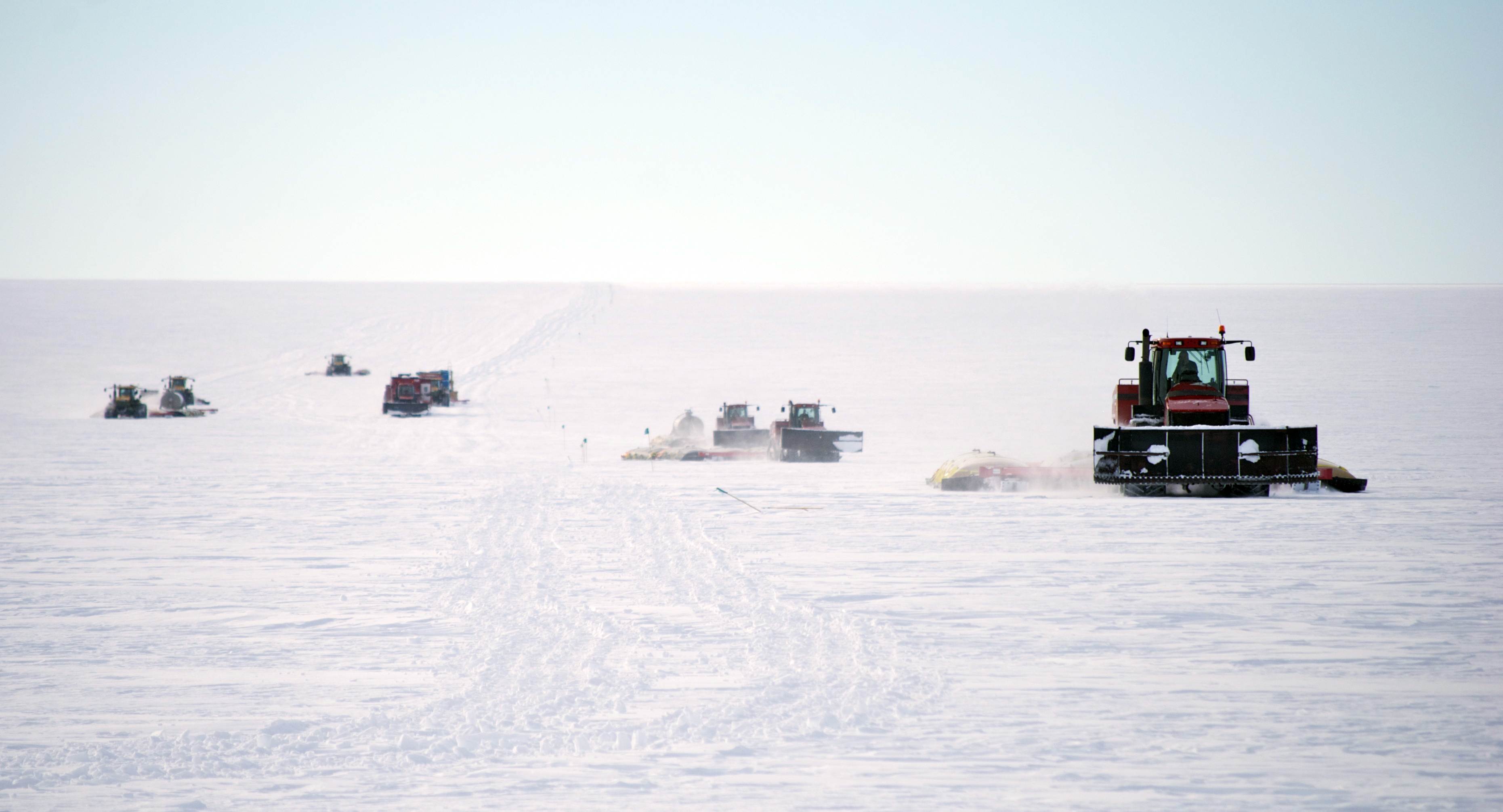 Tractors pulling sleds.