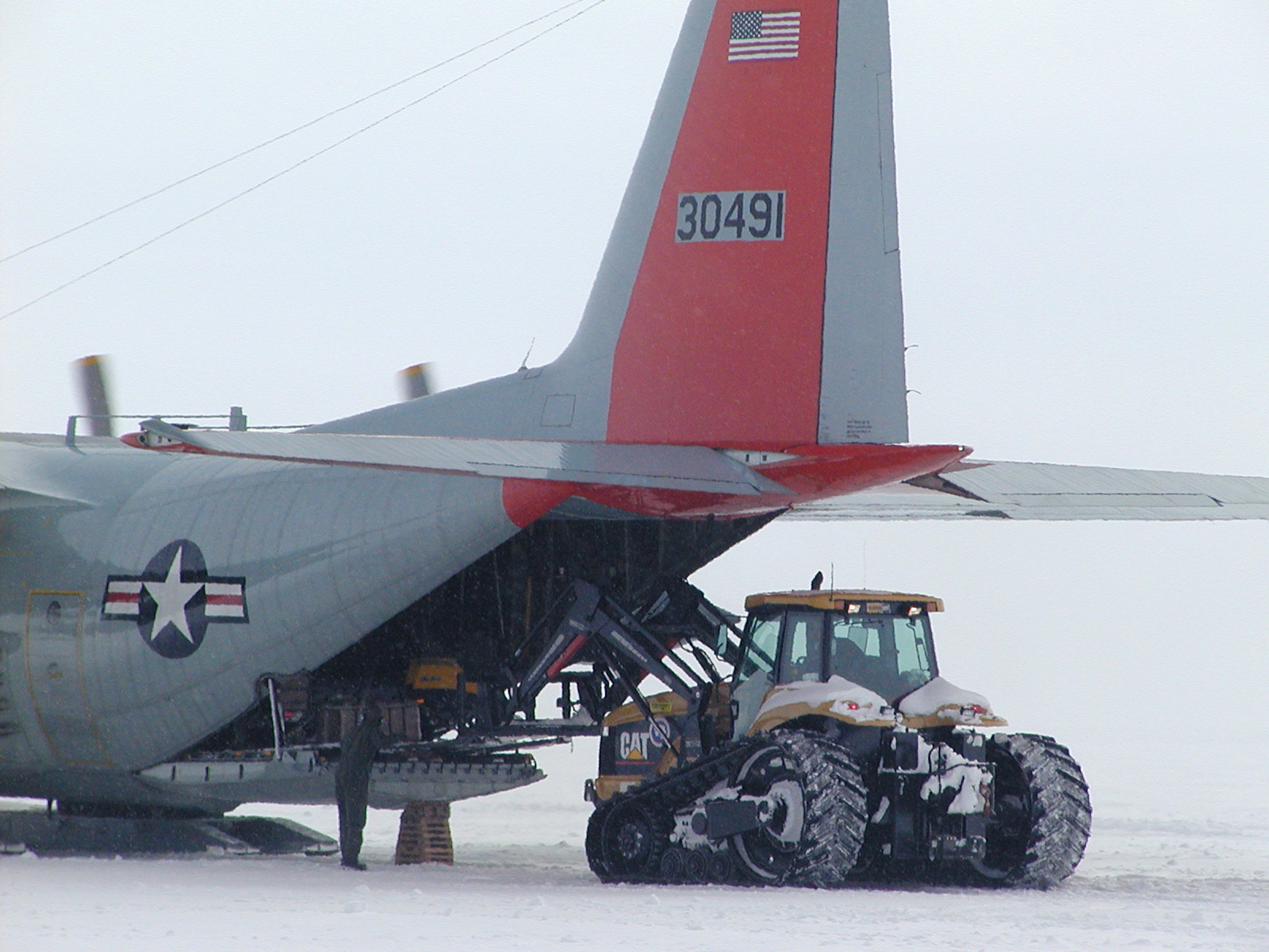 Unloading cargo from an airplane.