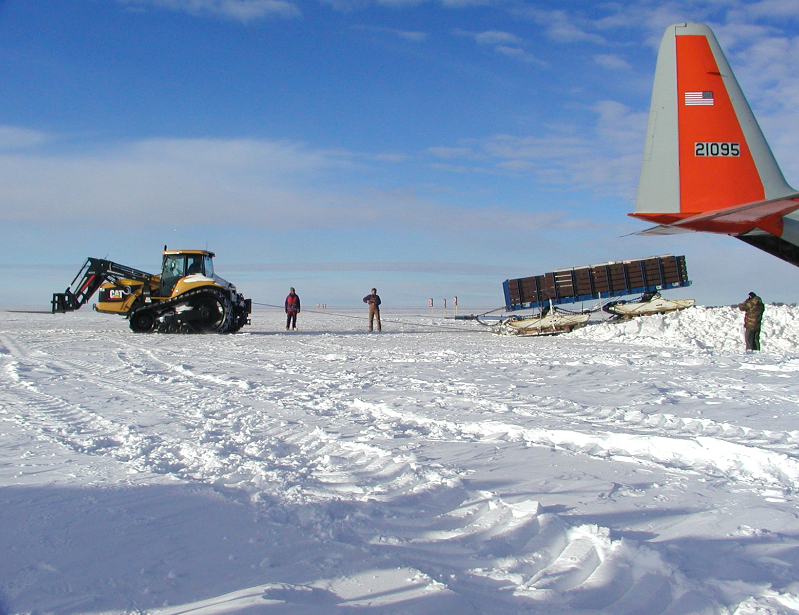 Unloading cargo from an airplane.