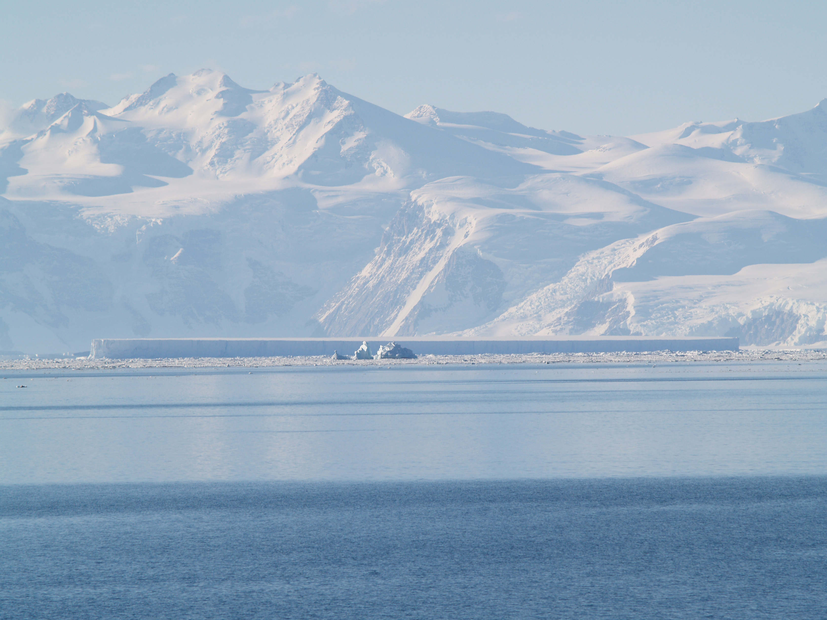 Snow covered mountains and ocean