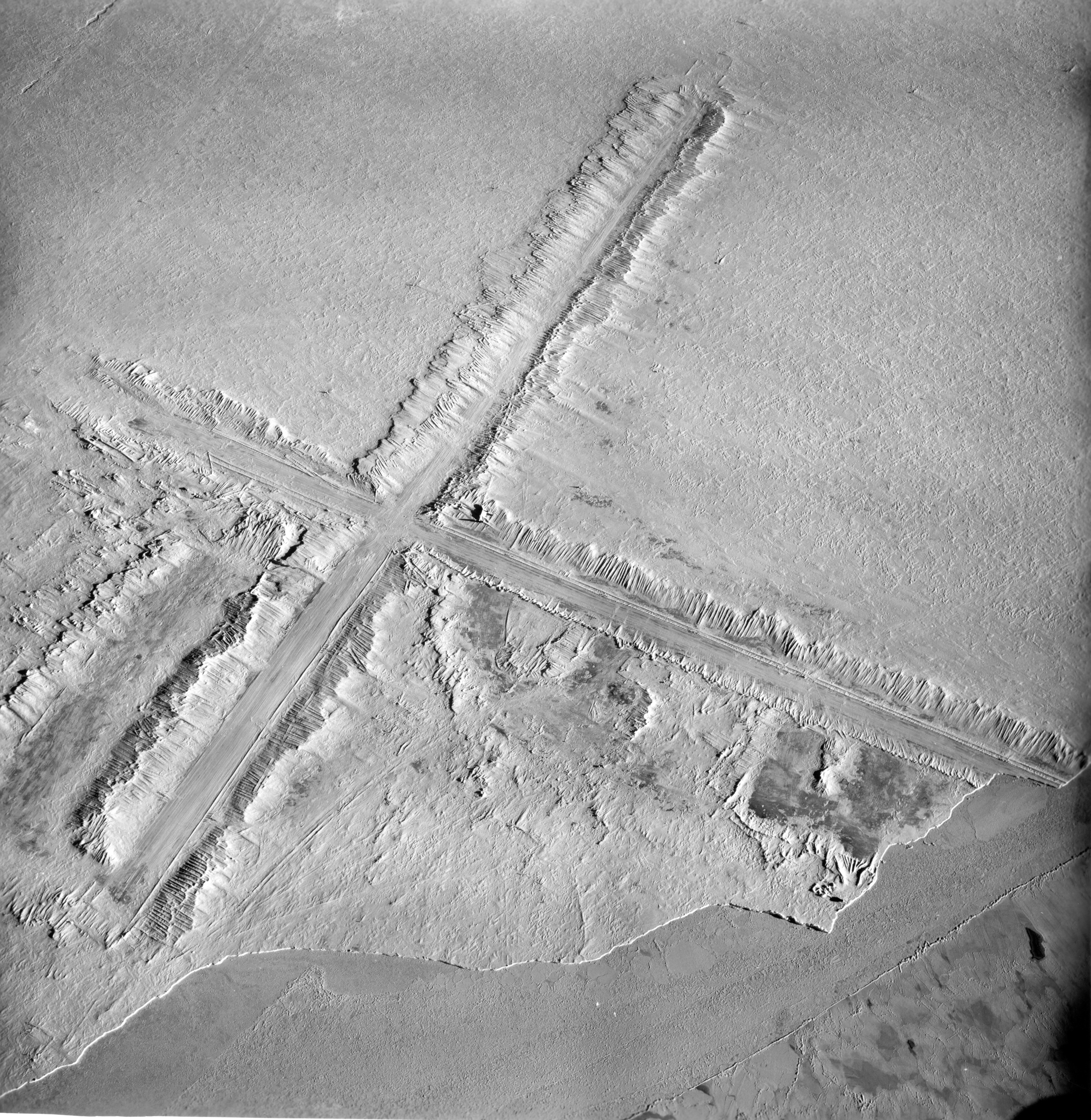 Landing strips plowed out of snow.