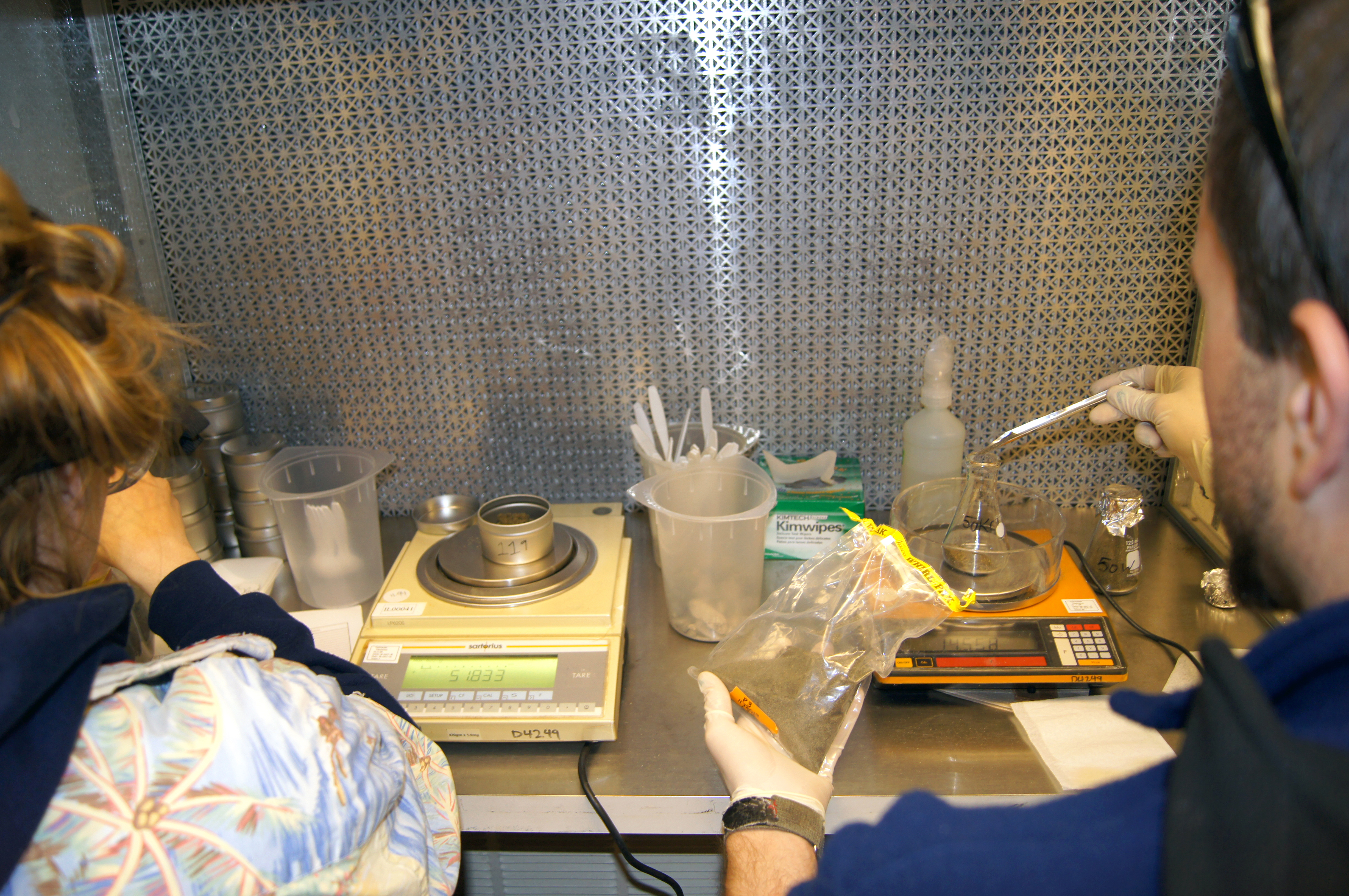 Two people working in a laboratory.