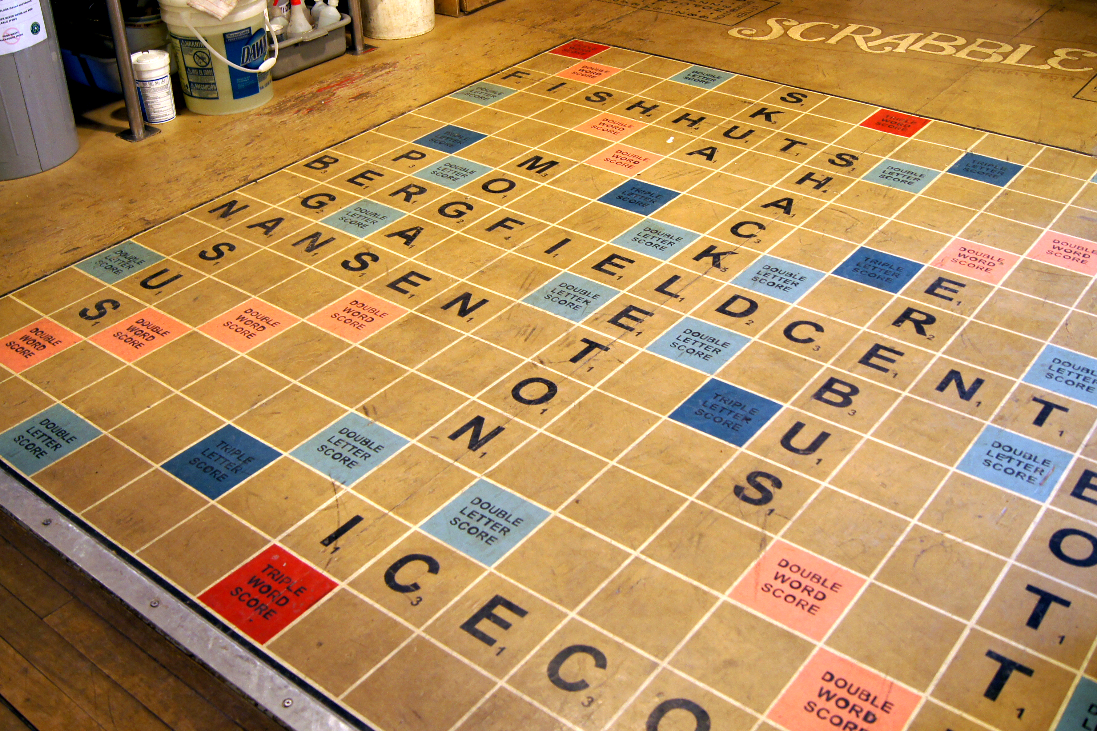 A large Scrabble board painted on a floor.