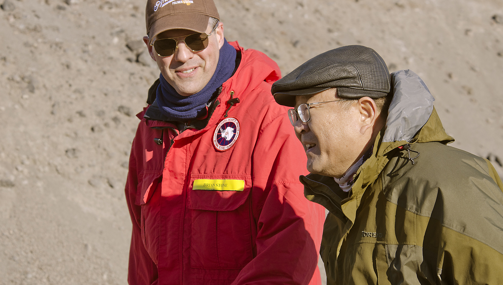 Brian Stone, NSF, escorts Qin Weijia at McMurdo Station. 