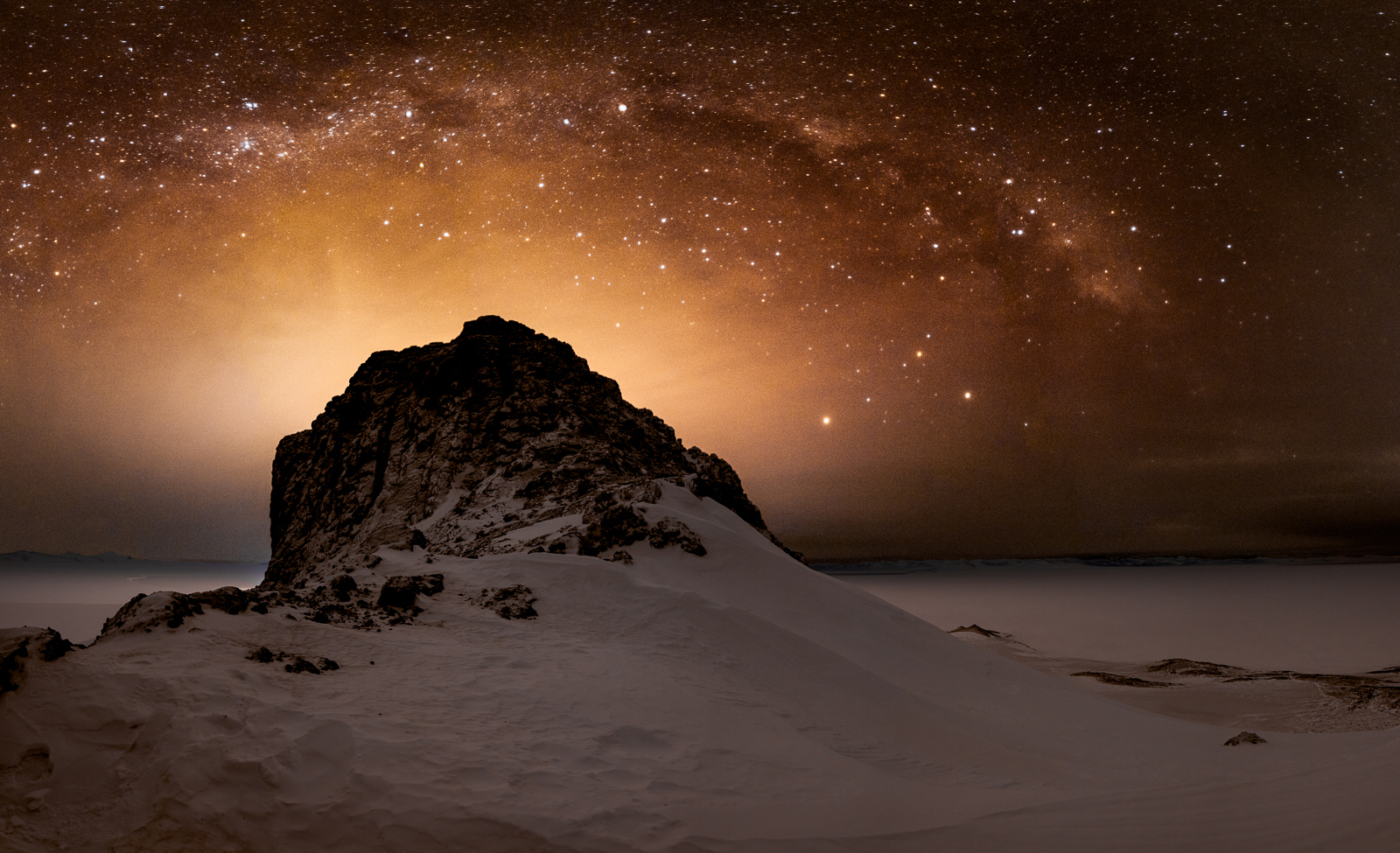 The Milky Way over a rock formation.