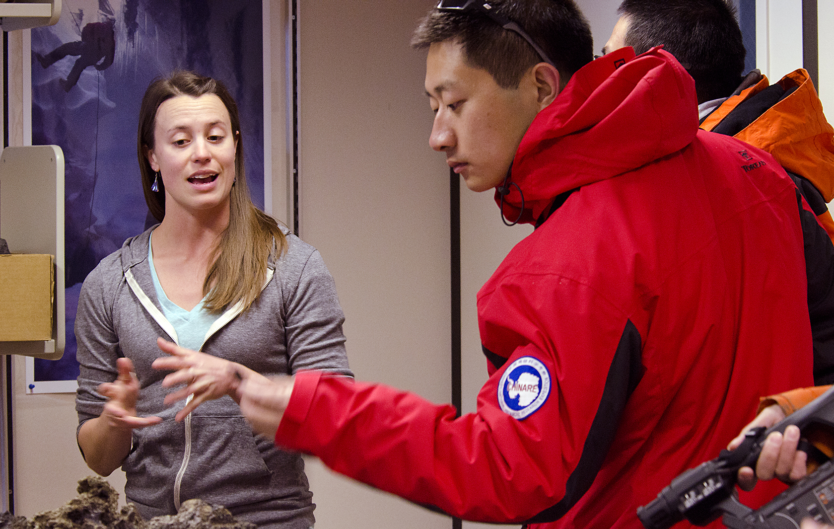 A woman talks to people from the Chinese Arctic and Antarctic Administration.