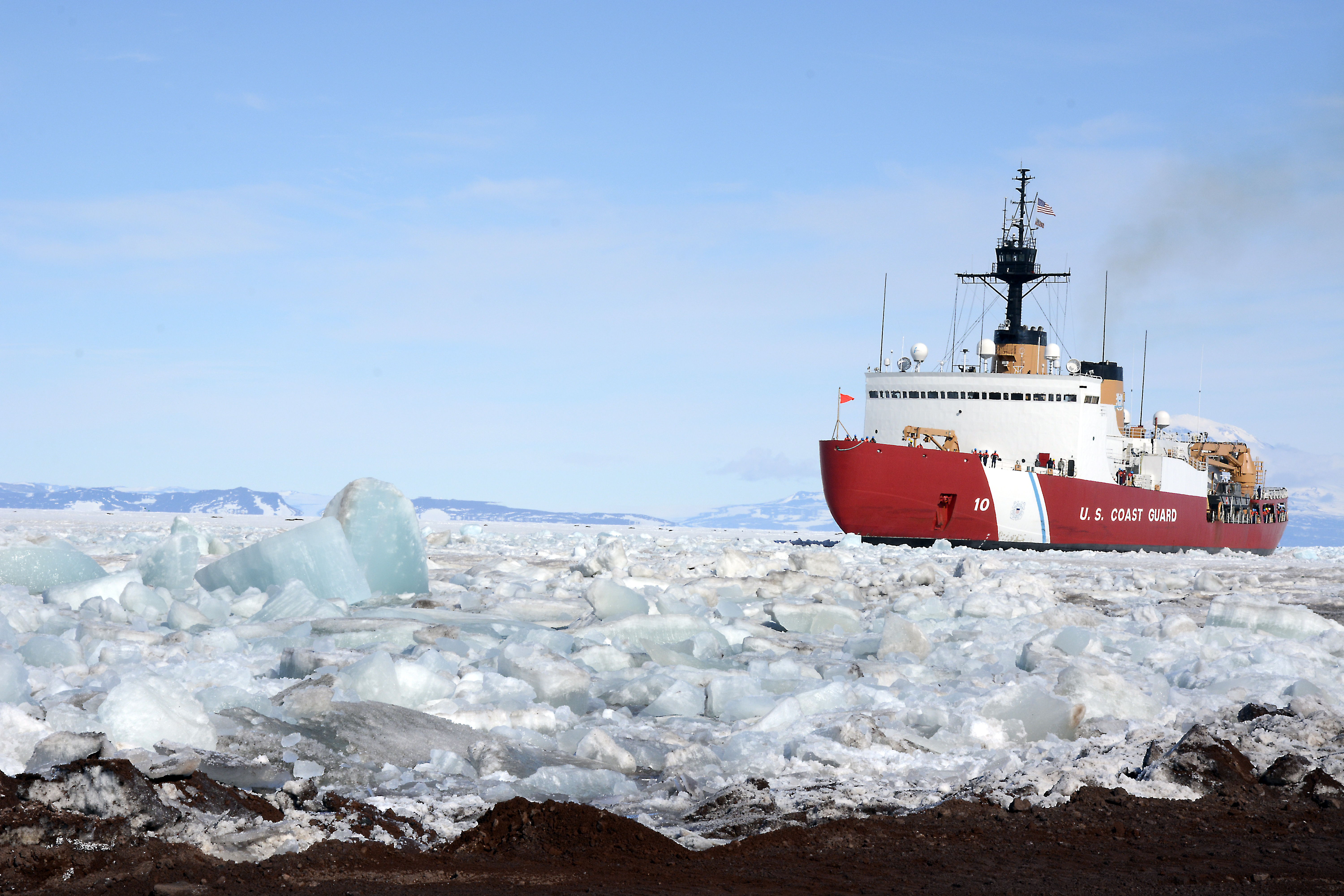 Ship pushes it way through ice.