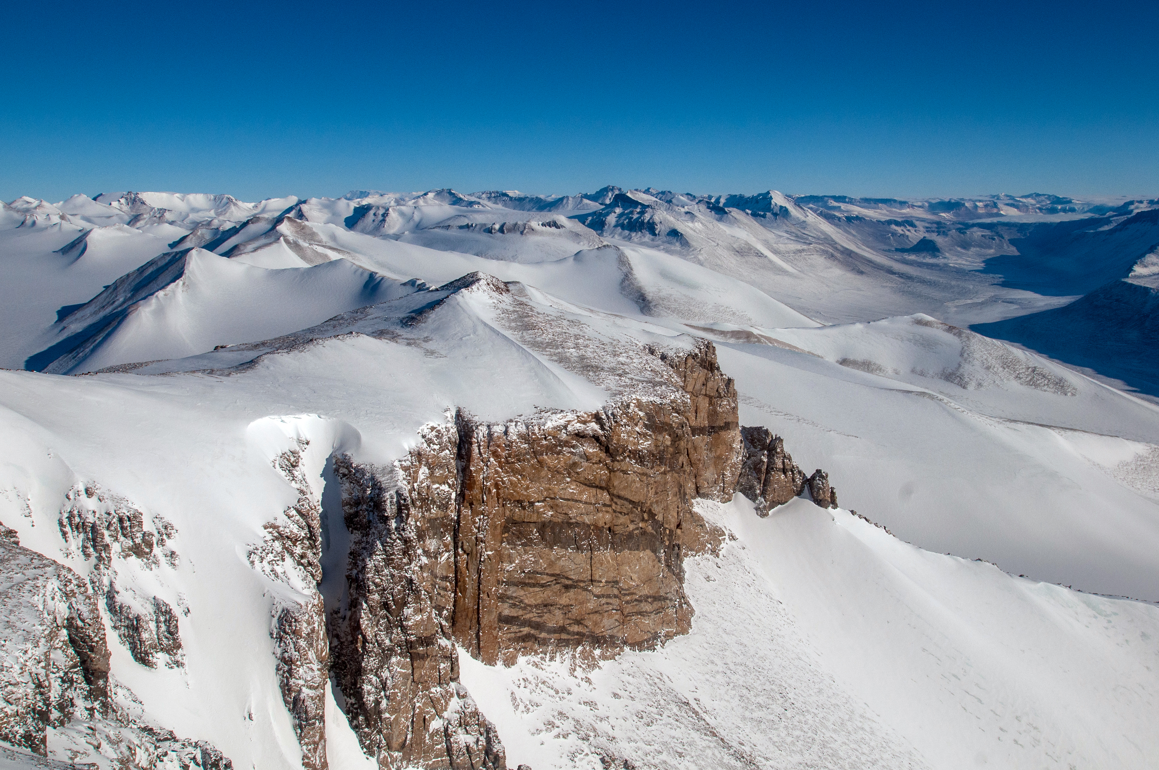 Snow covers mountains.