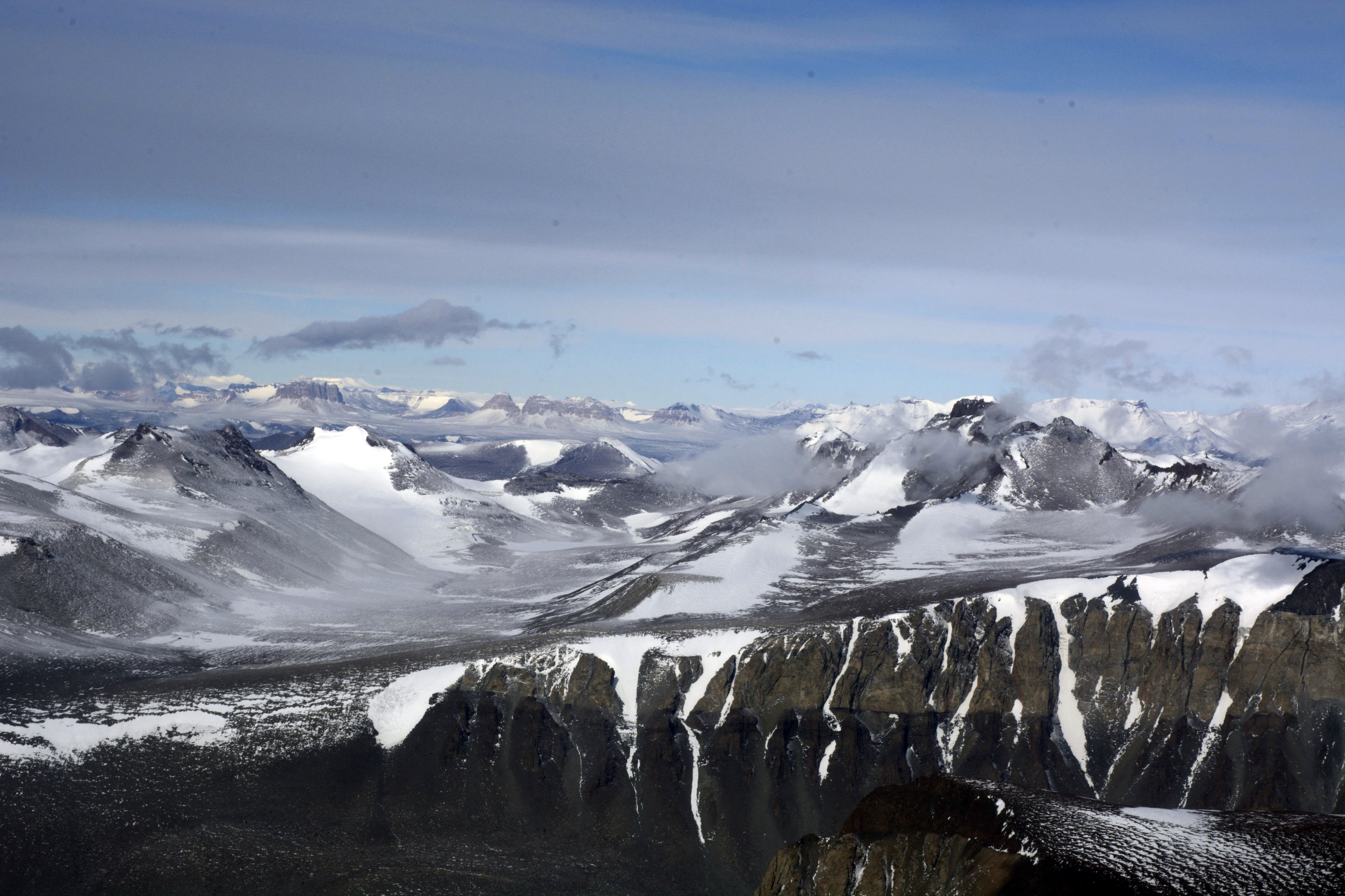 Aerial view of glaciated mountain range.