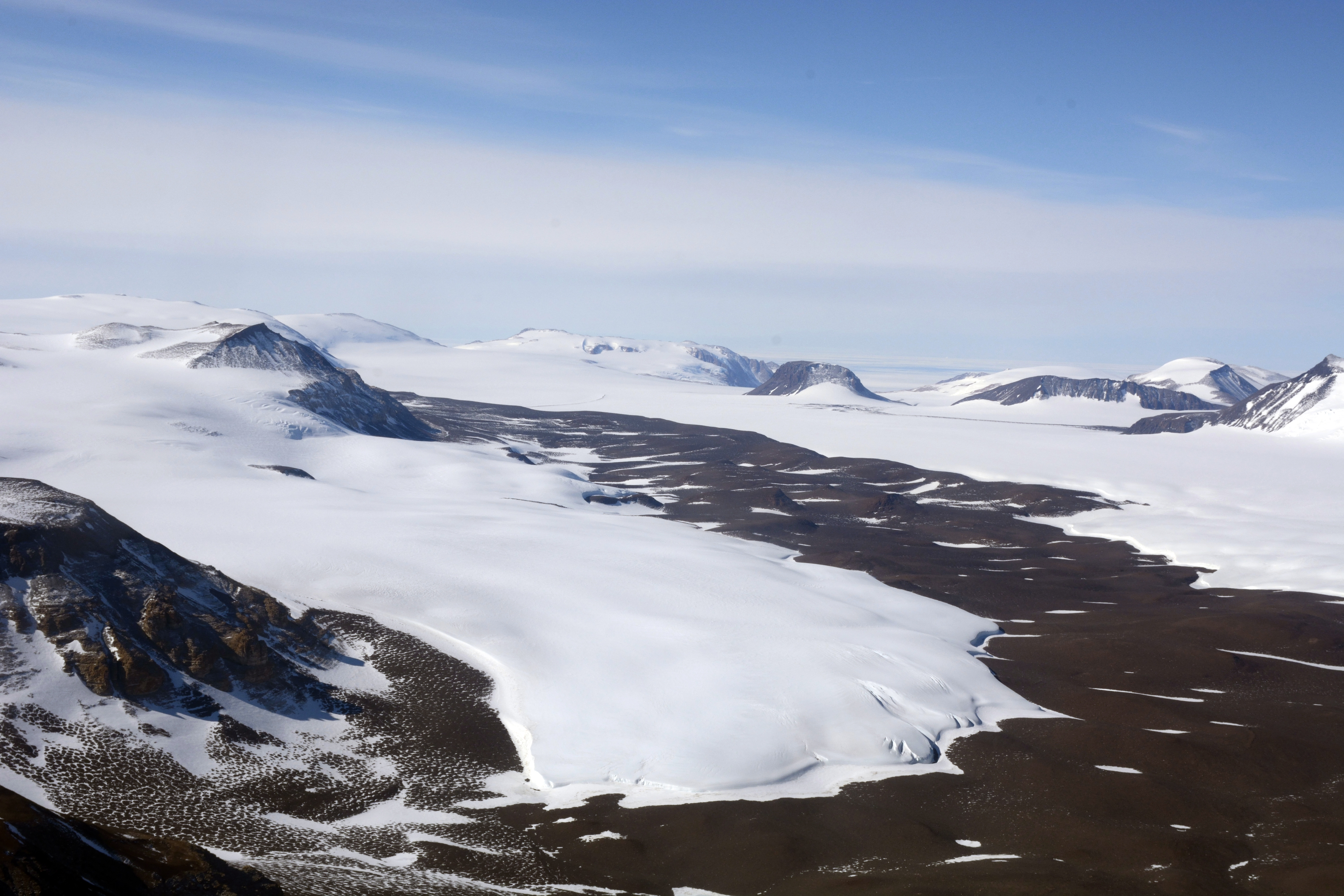 Aerial view of glaciated mountain range.