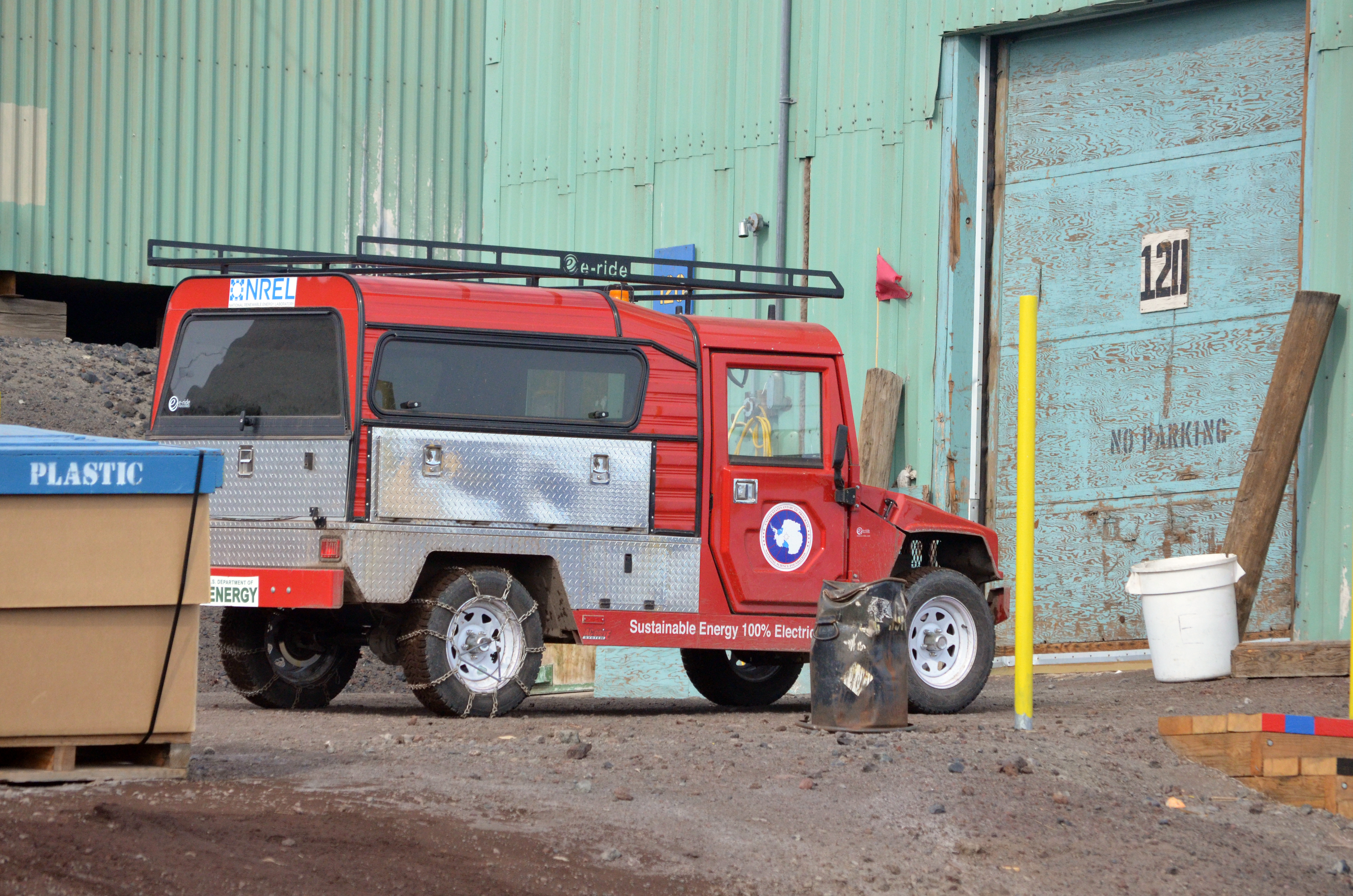 Small truck parked near building.