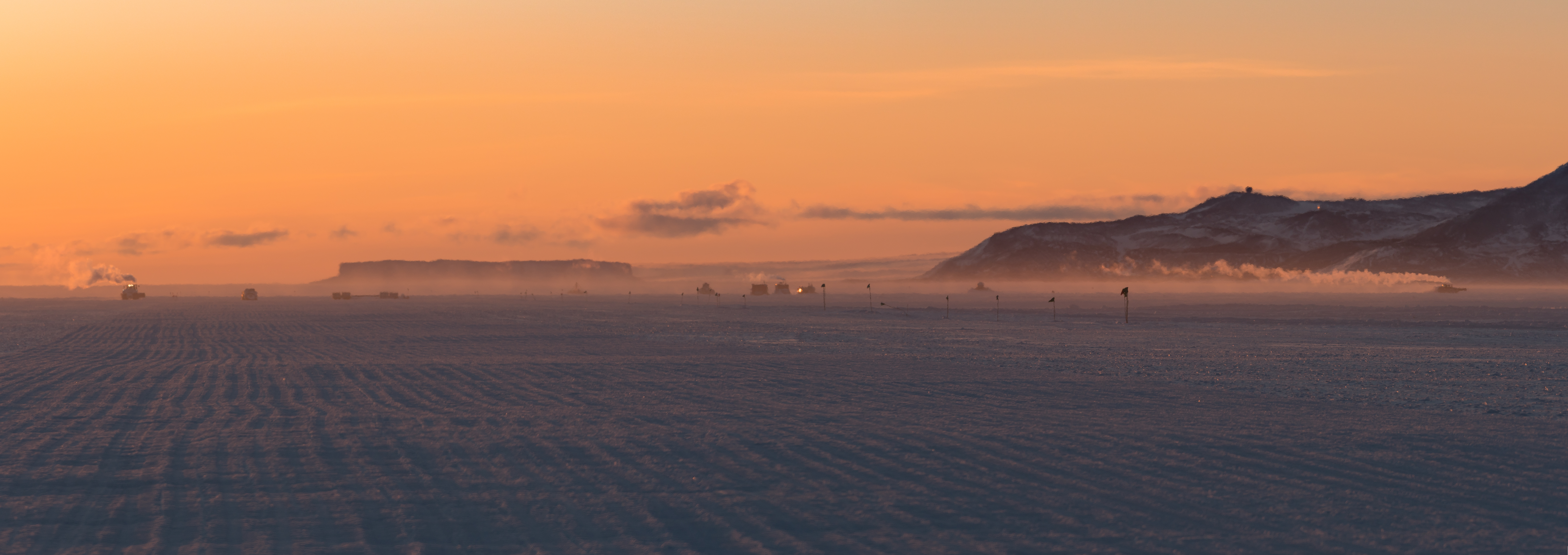 Sunset over a snow covered landscape.