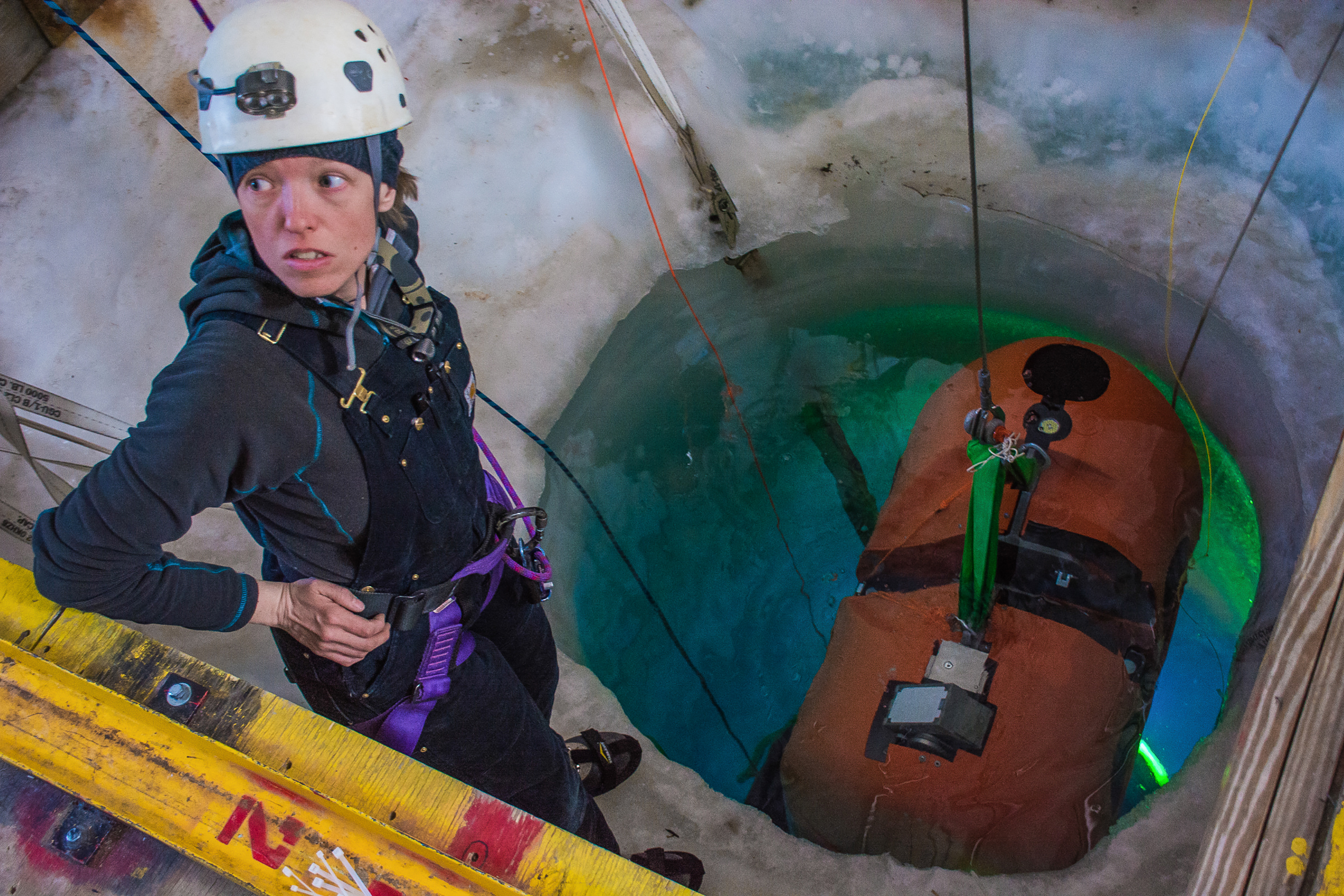 Person over a hole in the ice.