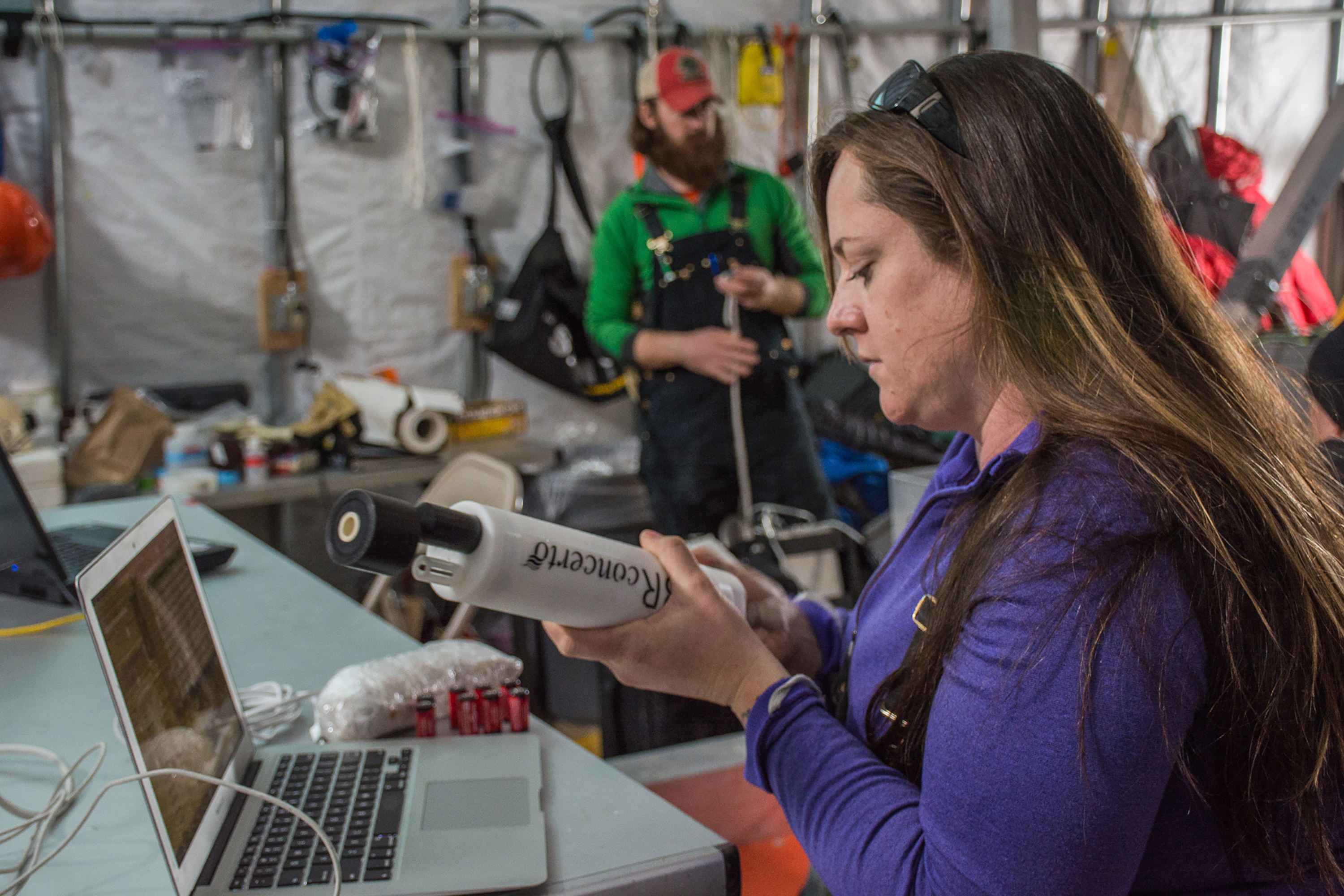A woman holding scientific equipment.