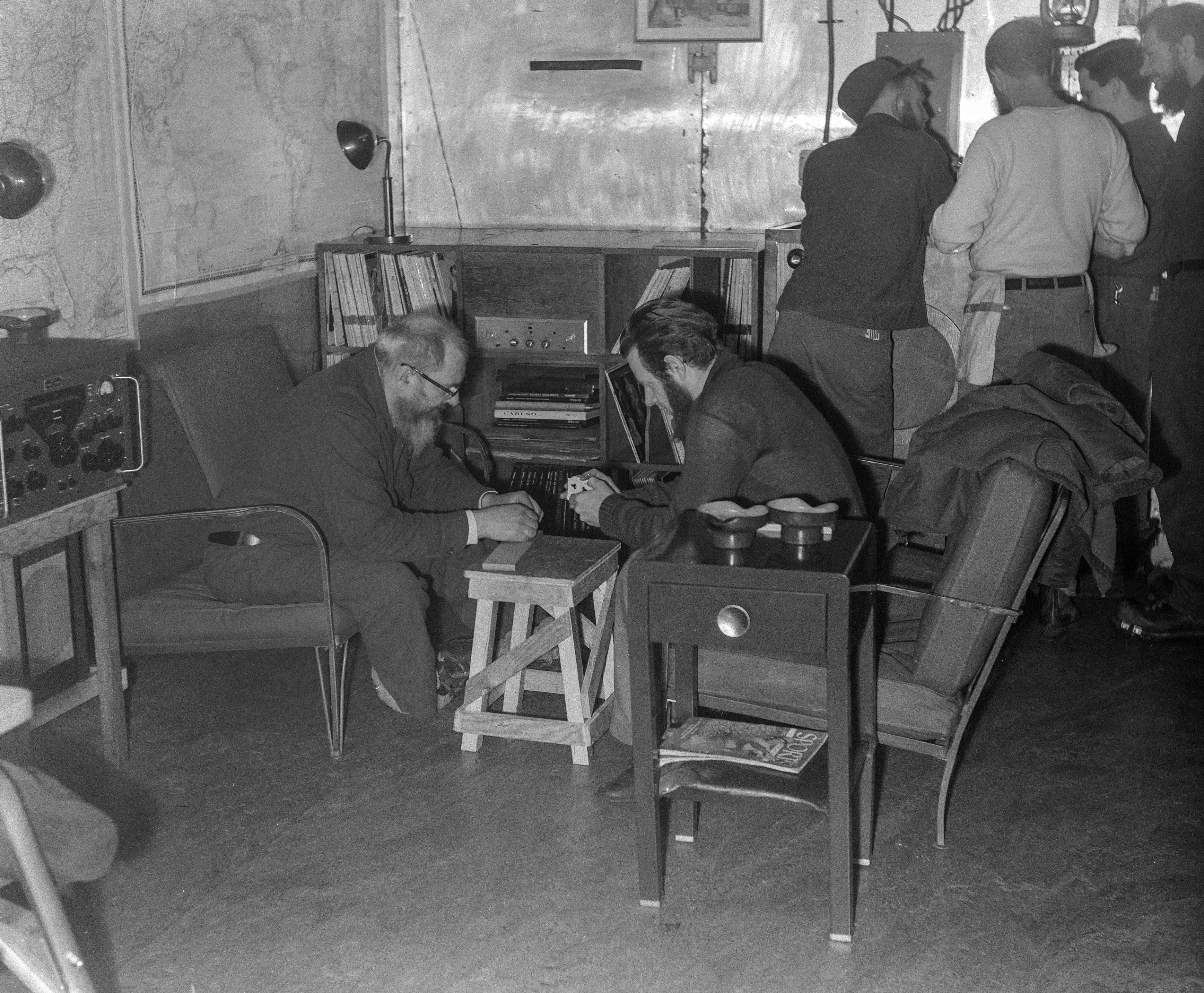 Black and white photo of two men playing a game.