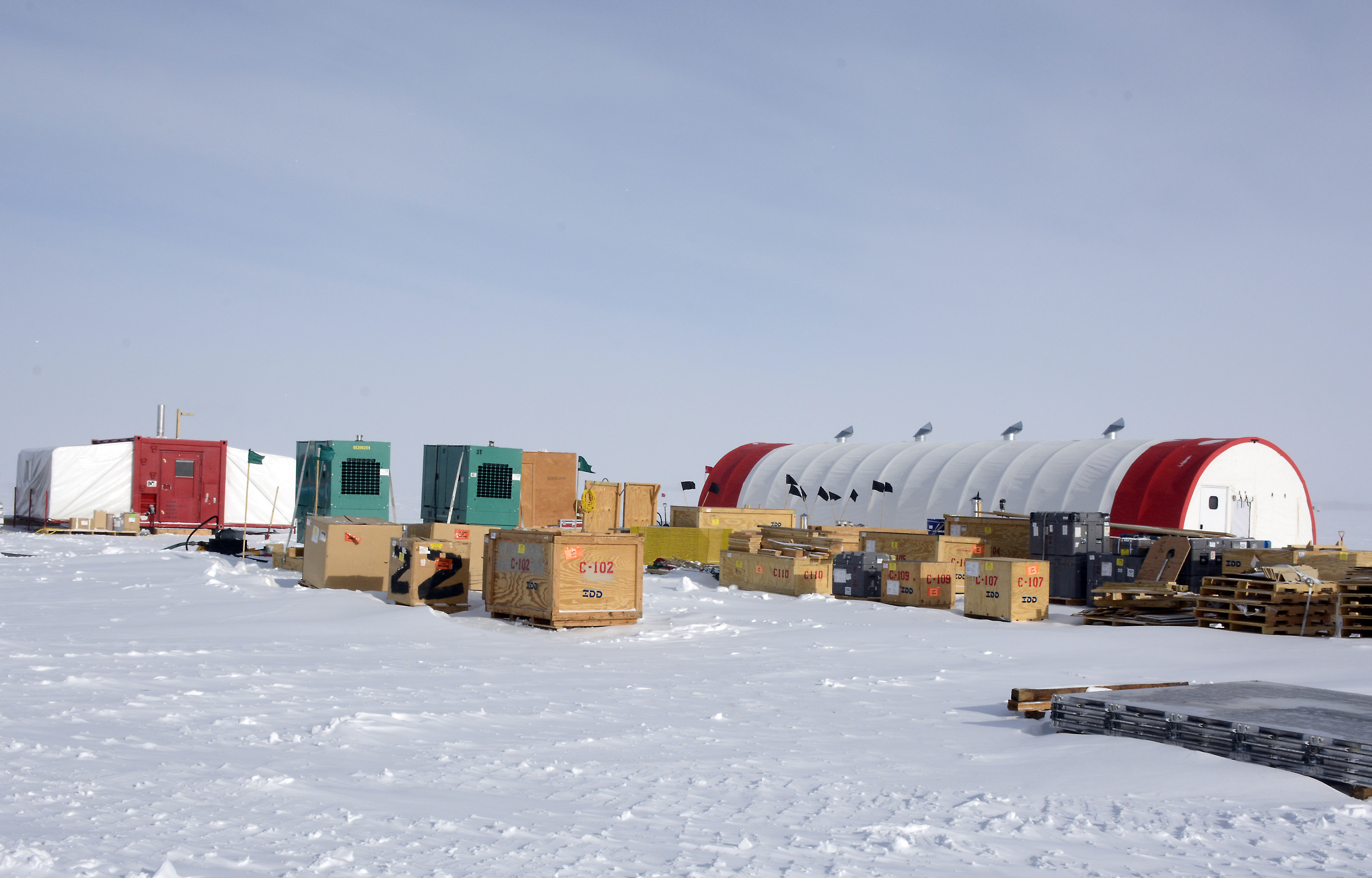 Tents and cargo on snow.