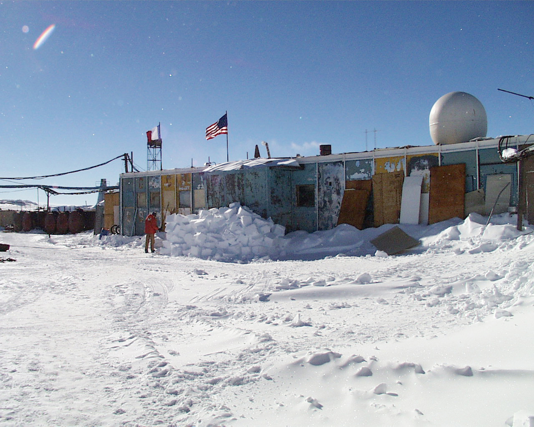 The front of a building surrounded by snow.