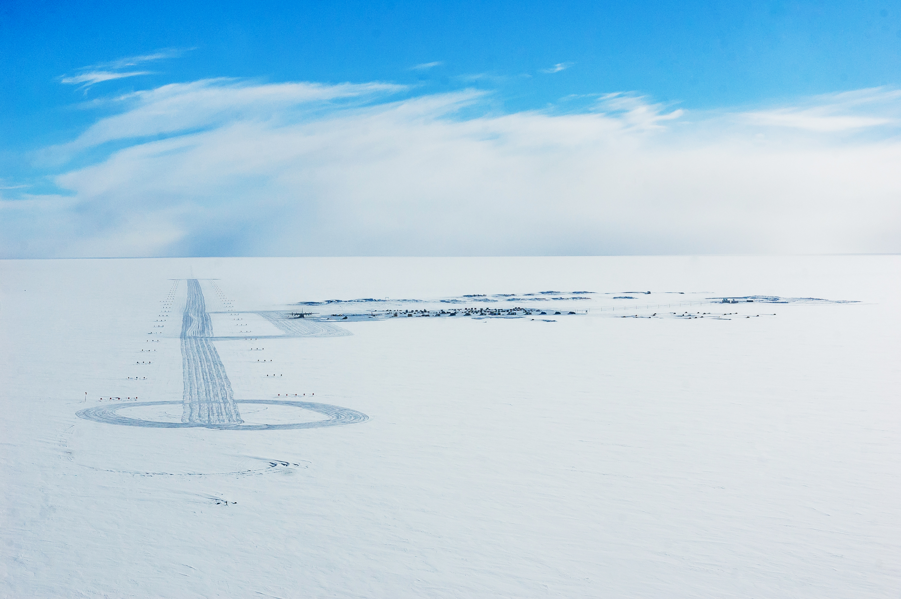 Aerial view of camp on ice.